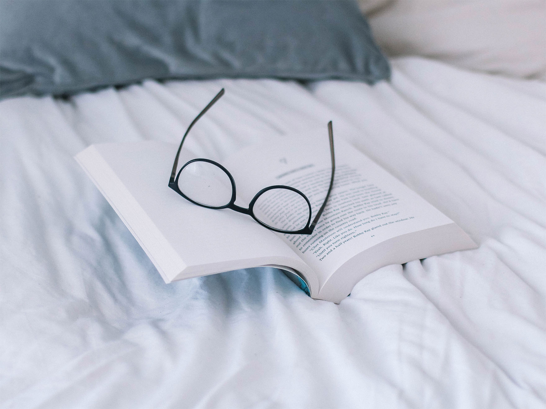 open book with reading glasses